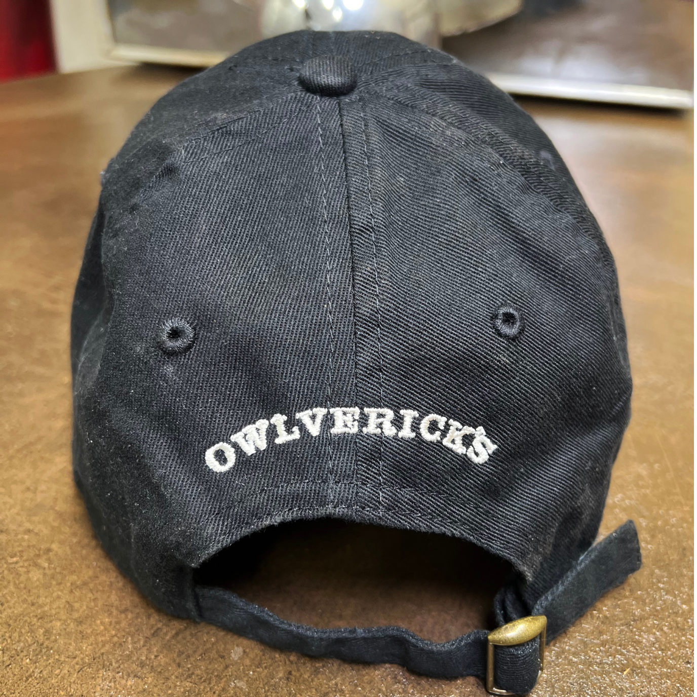 Back of dad hat in Black color with "Owlverick's" embroidery