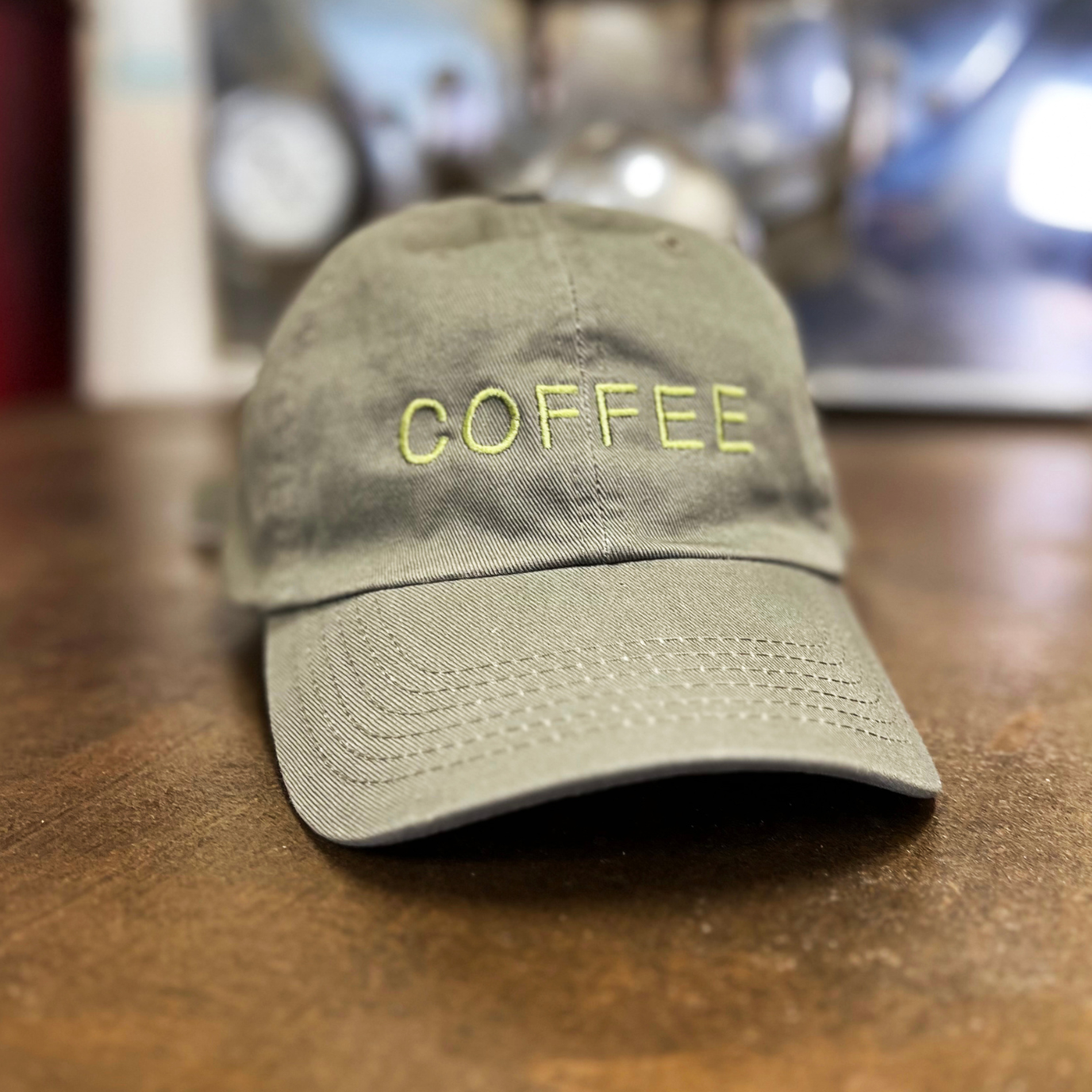 Dad hat in Green color with "COFFEE" embroidery